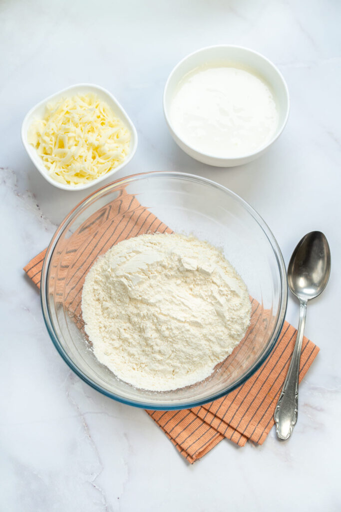 Ingredients for Greek yogurt bagel dough prepared on the counter