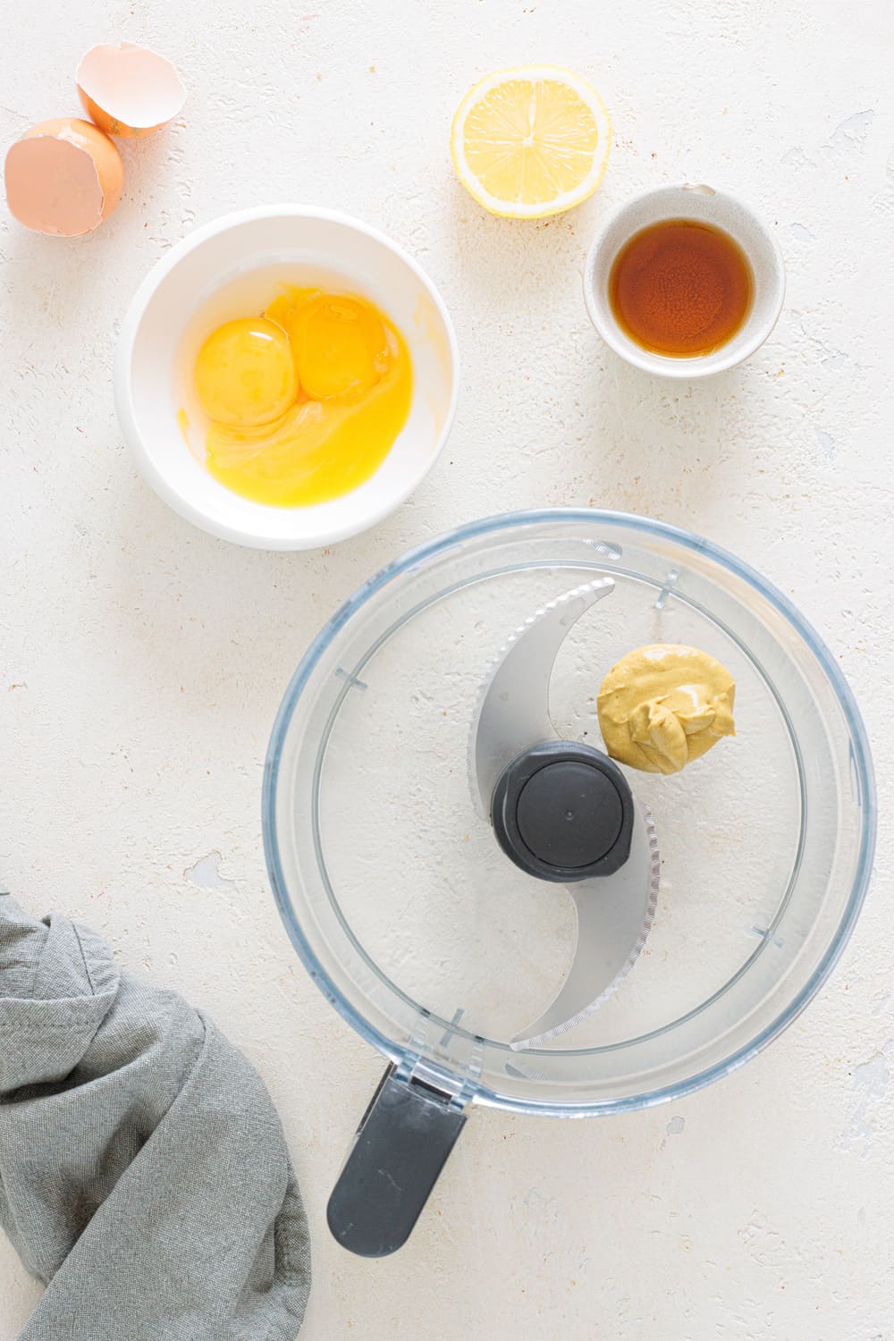 Egg yolks, Dijon mustard, vinegar, and lemon