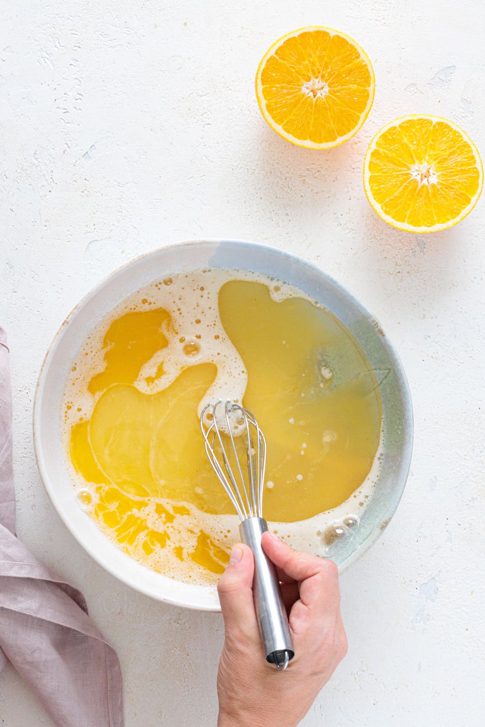 Mixing orange juice and eggs