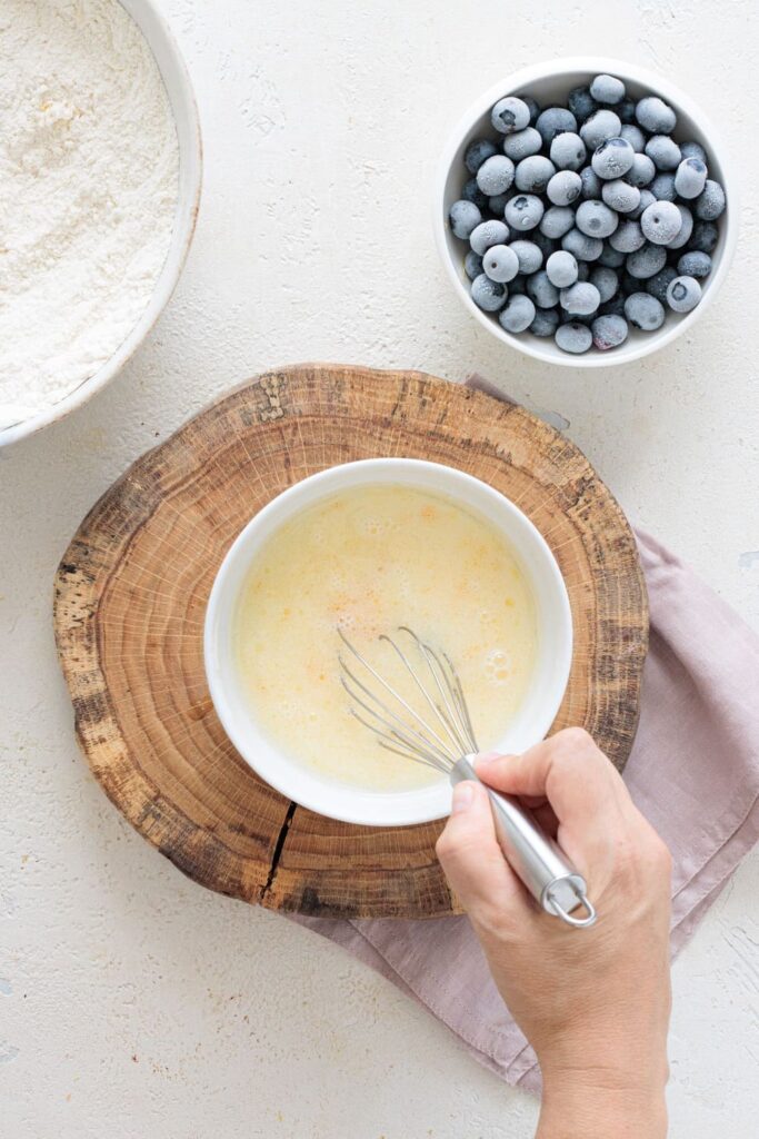 Mixing wet ingredients for easy blueberry muffin batter