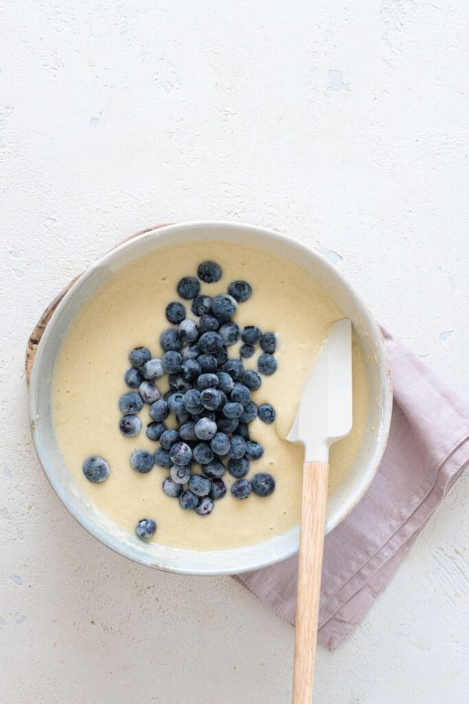 Folding blueberries into batter