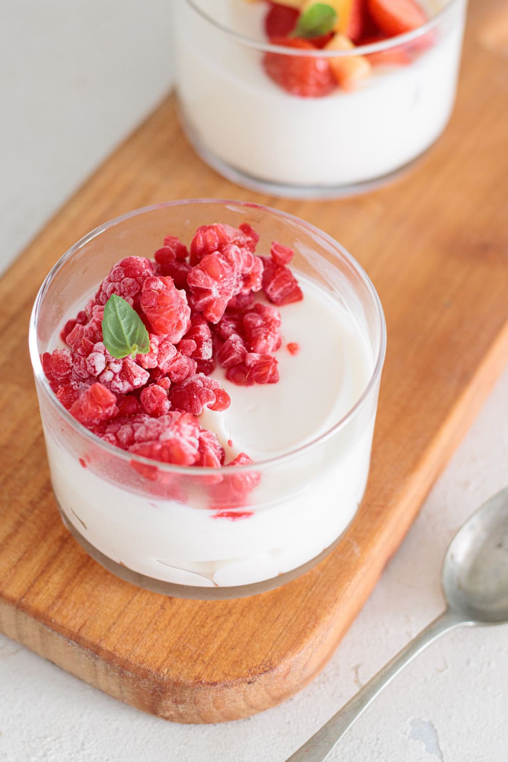 Keto cheesecake topped with fresh raspberries