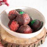 Rich chocolate peanut butter balls decorated with colorful sprinkles, ready to enjoy.