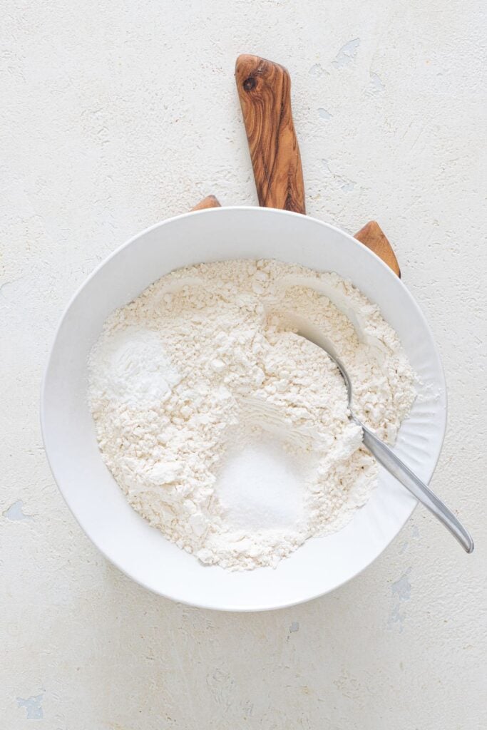 Flour, baking powder, and salt mixed in a bowl for no-yeast bread