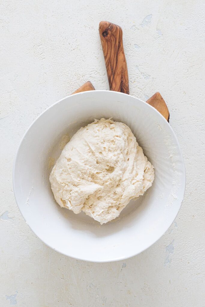 Soft bread dough formed into a ball before shaping
