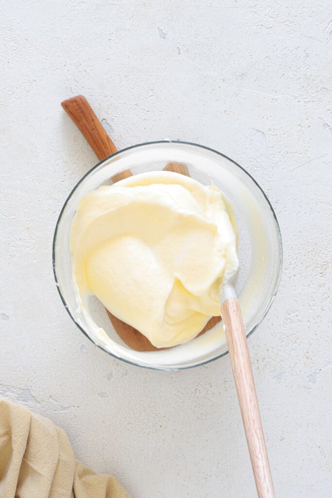 Smooth keto cloud bread batter in mixing bowl with spatula
