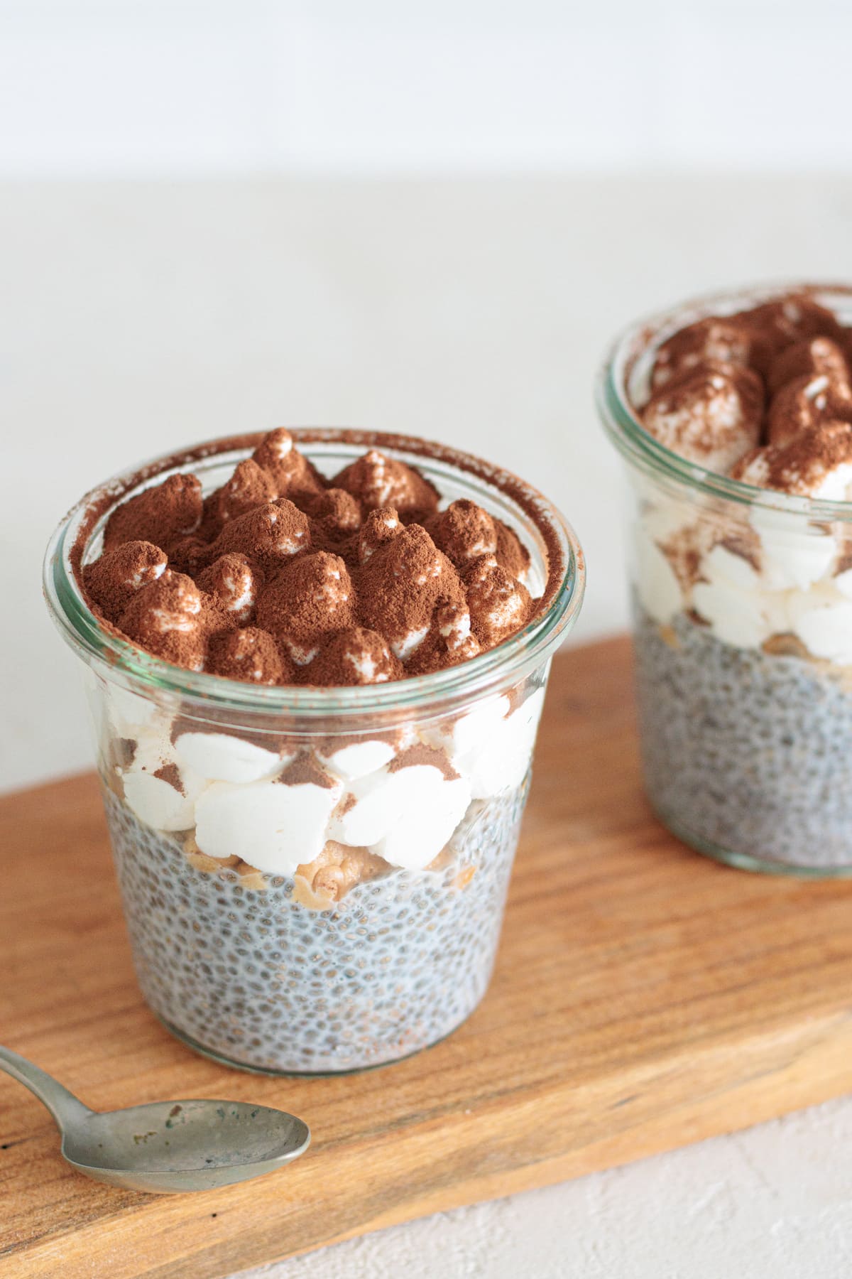 Finished tiramisu chia pudding topped with cocoa powder.