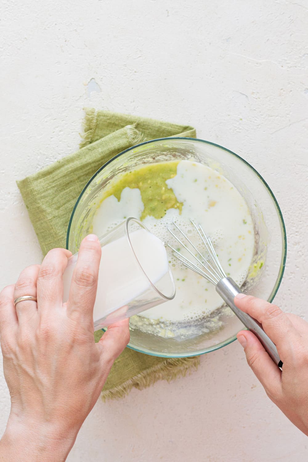 Pour in the milk and whisk gently