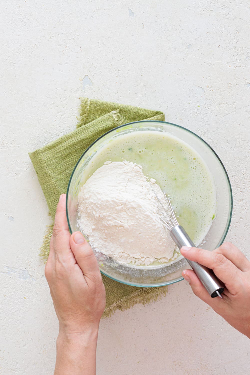Sift in the flour and baking powder to make a lump-free batter