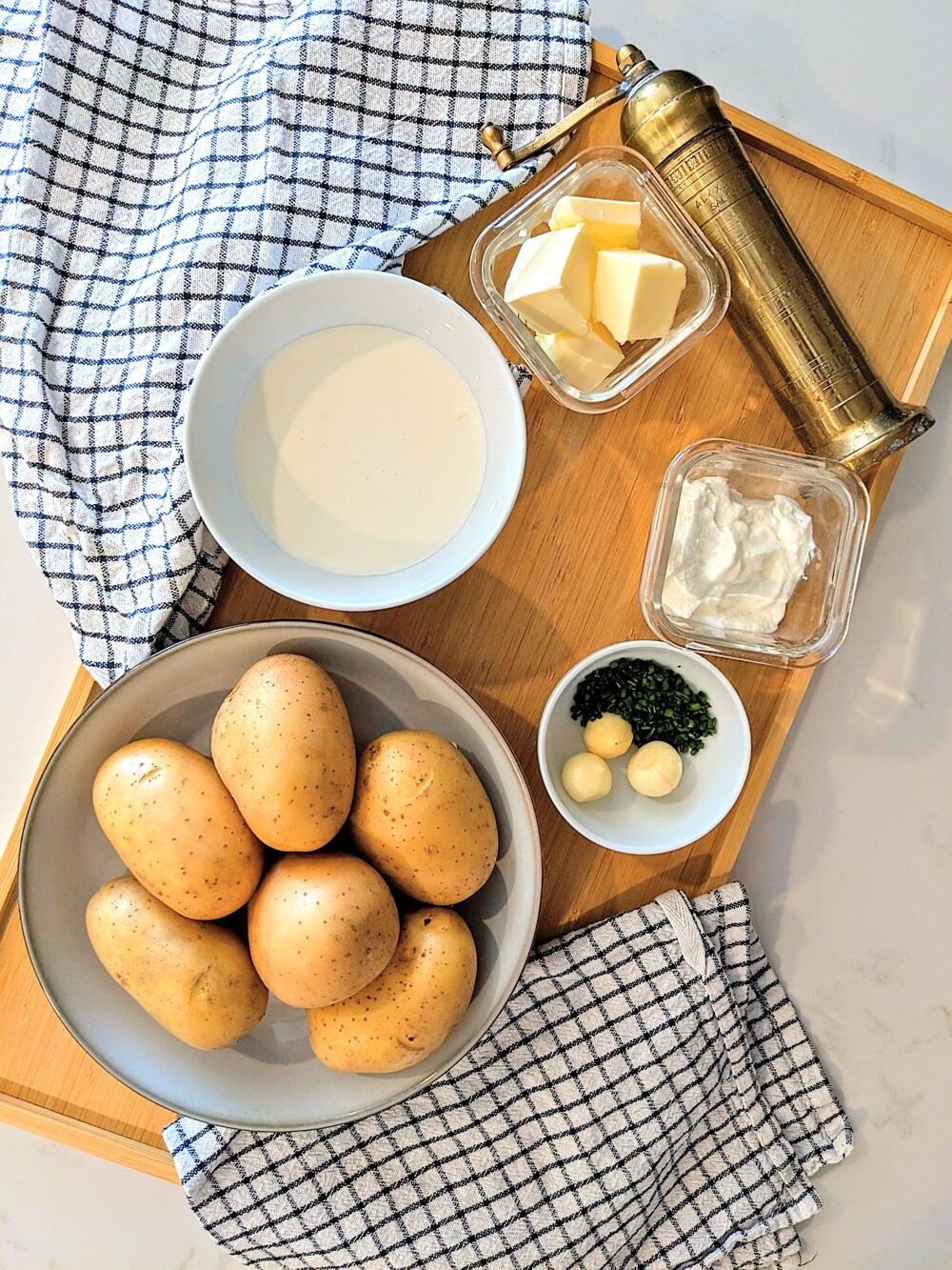 Rustic mashed potato ingredients on a table