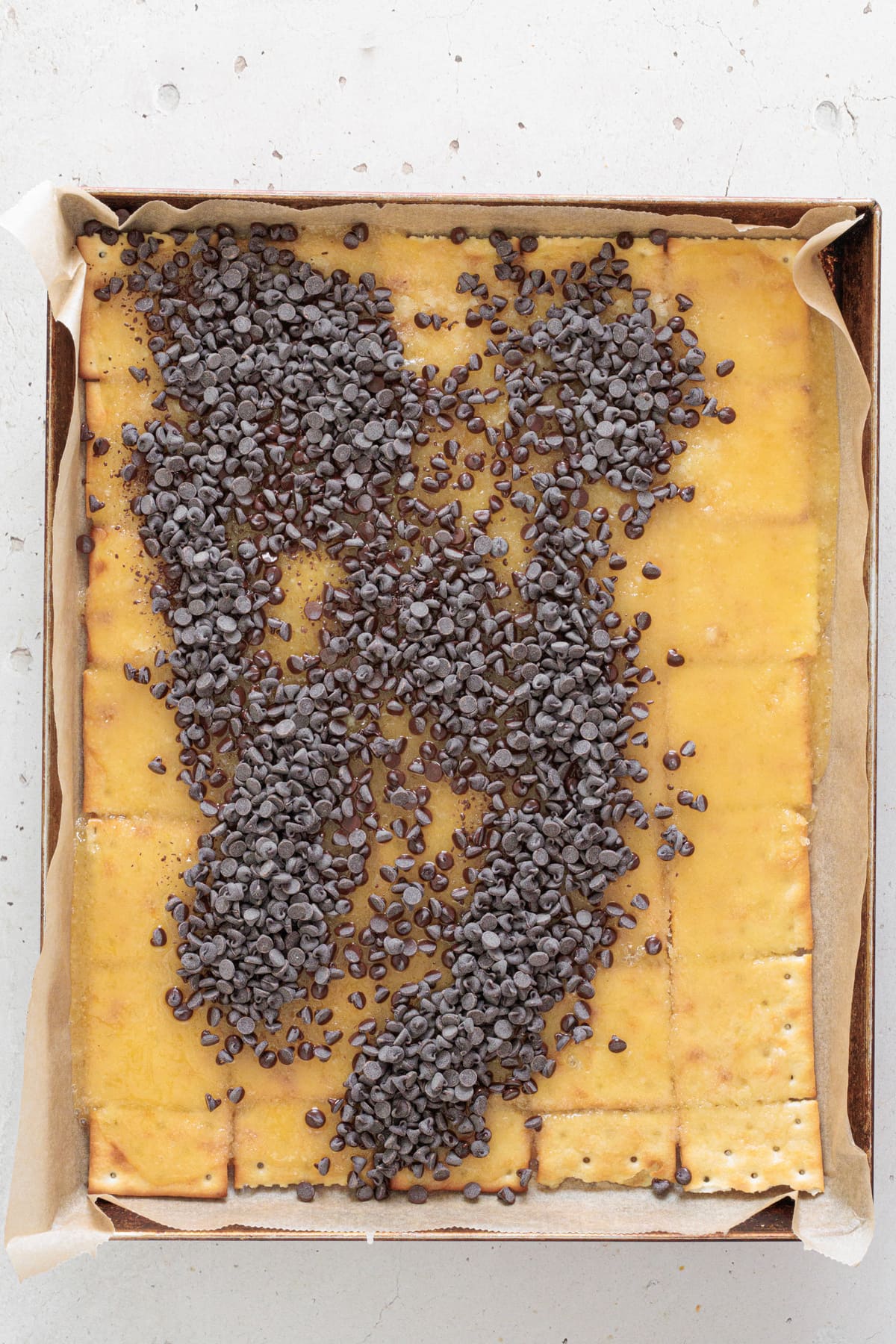 Chocolate chips on caramel crackers.