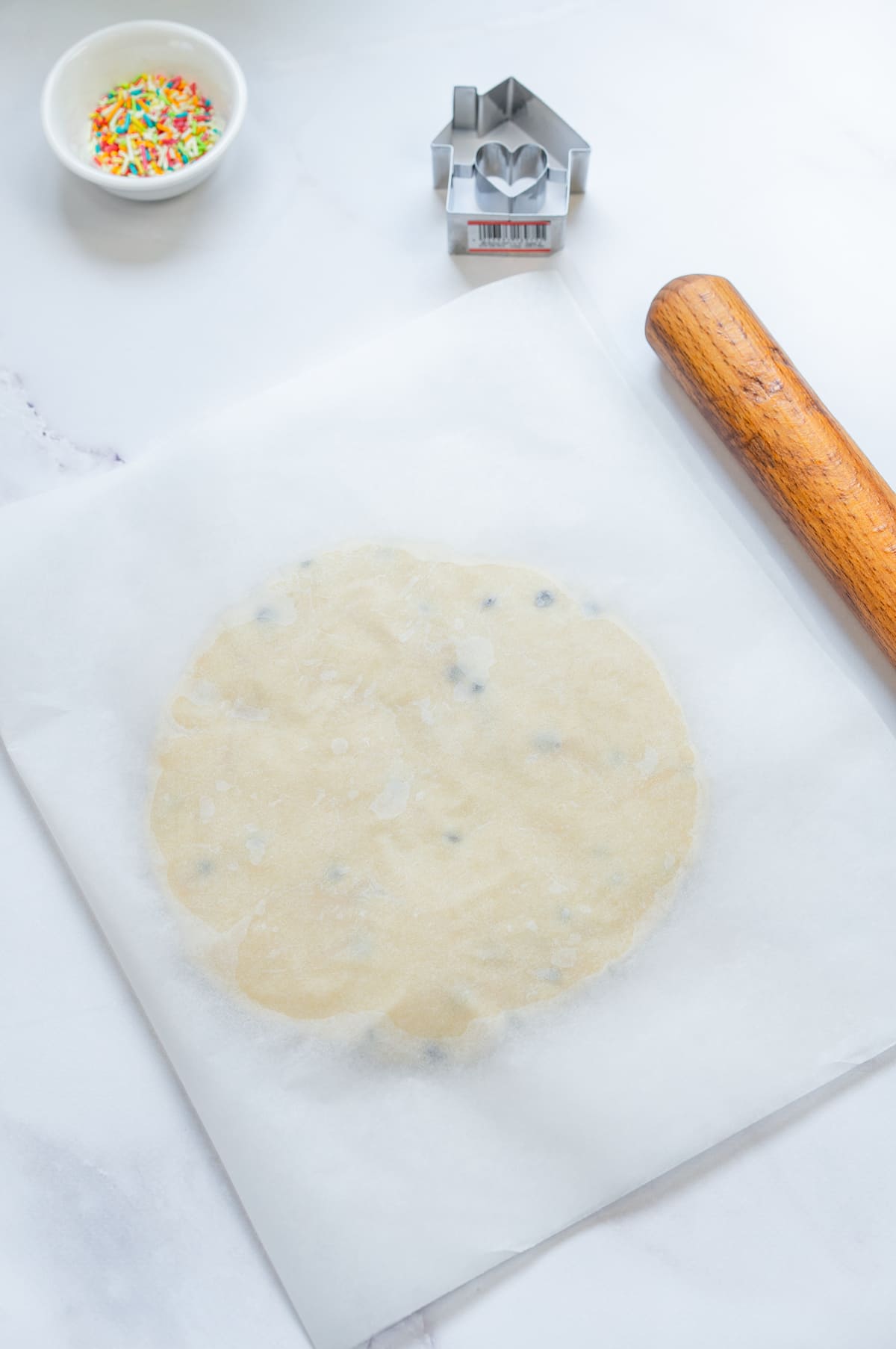 Roll the dough out between parchment sheets.