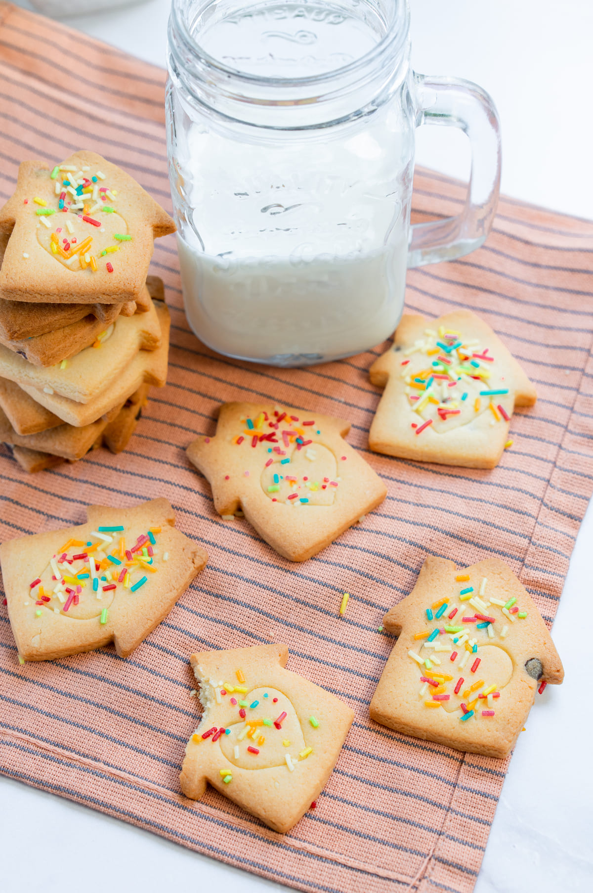 Stacked and scattered Christmas cookies, perfect for holiday snacking.