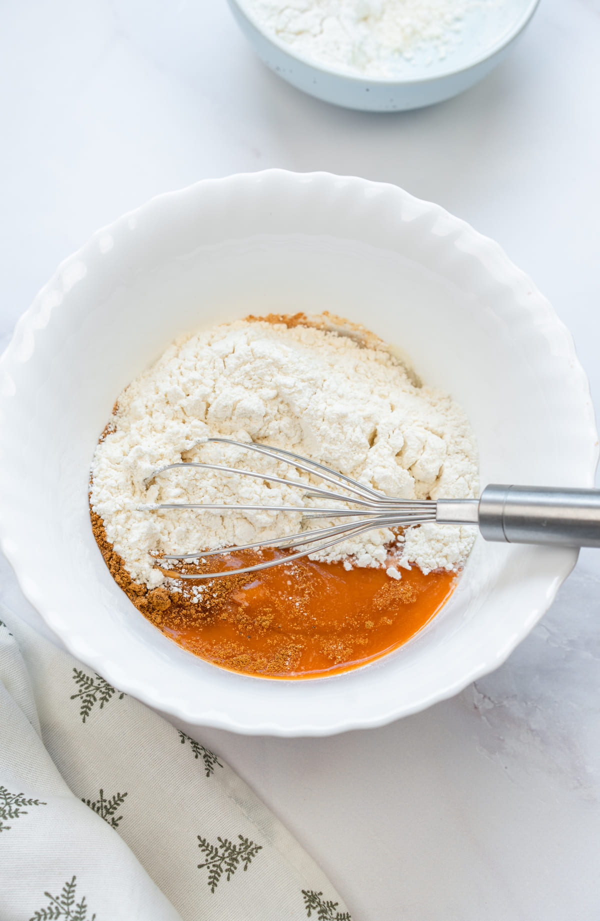 Add pumpkin purée, flour, and cinnamon to the eggs.