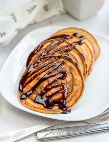 3-Ingredient Pumpkin Pancakes with chocolate drizzle.
