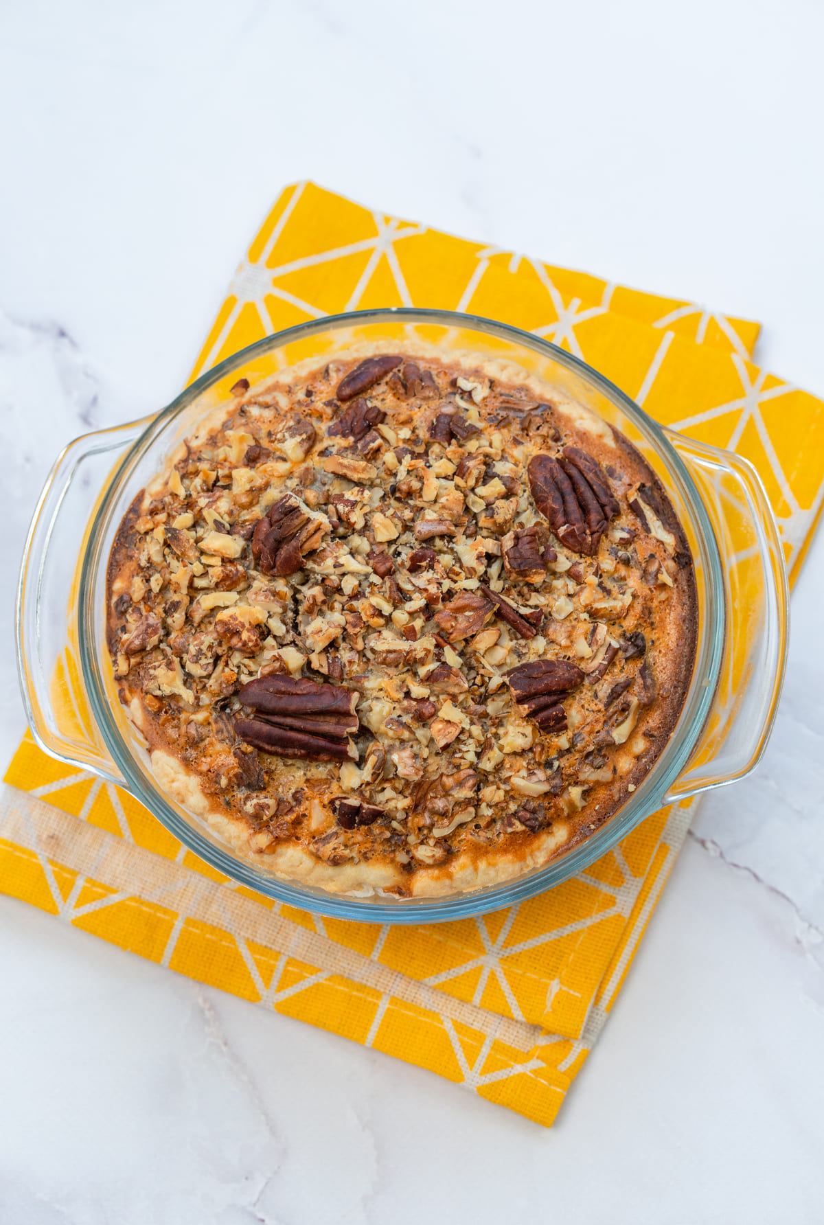 Golden-baked pecan pie cooling before slicing.
