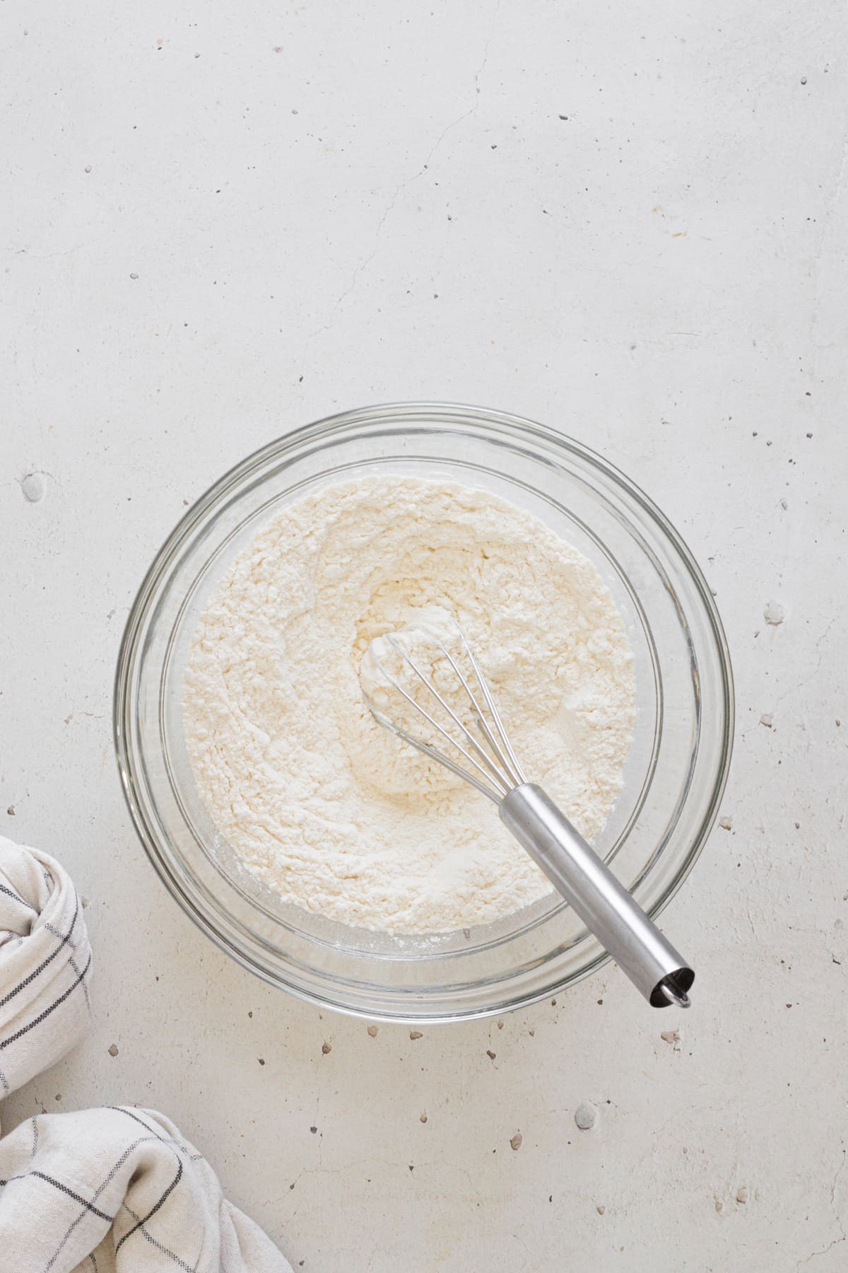 Bowl of flour and baking powder with a whisk