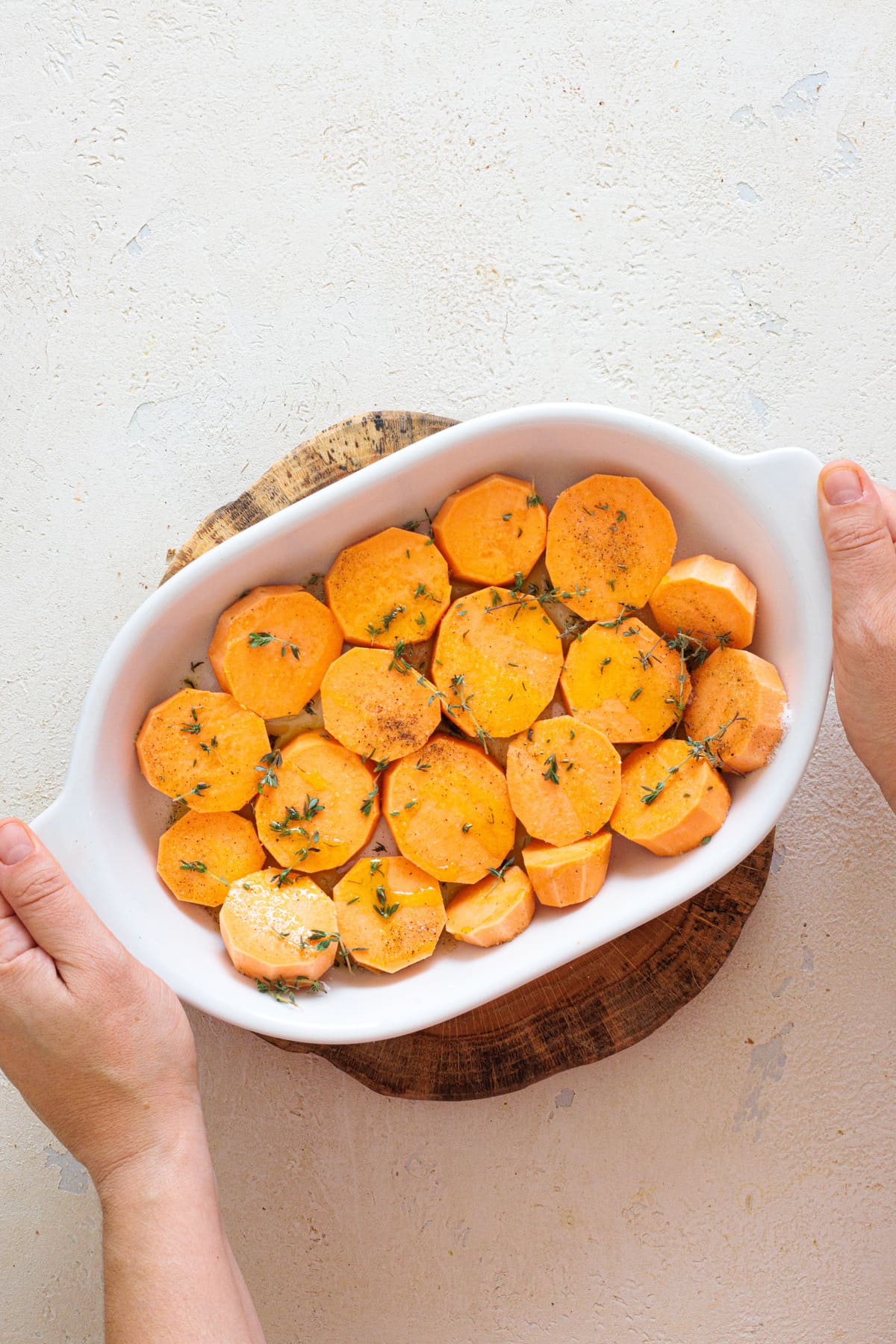 Medallions placed in a baking dish, seasoned and ready to bake.