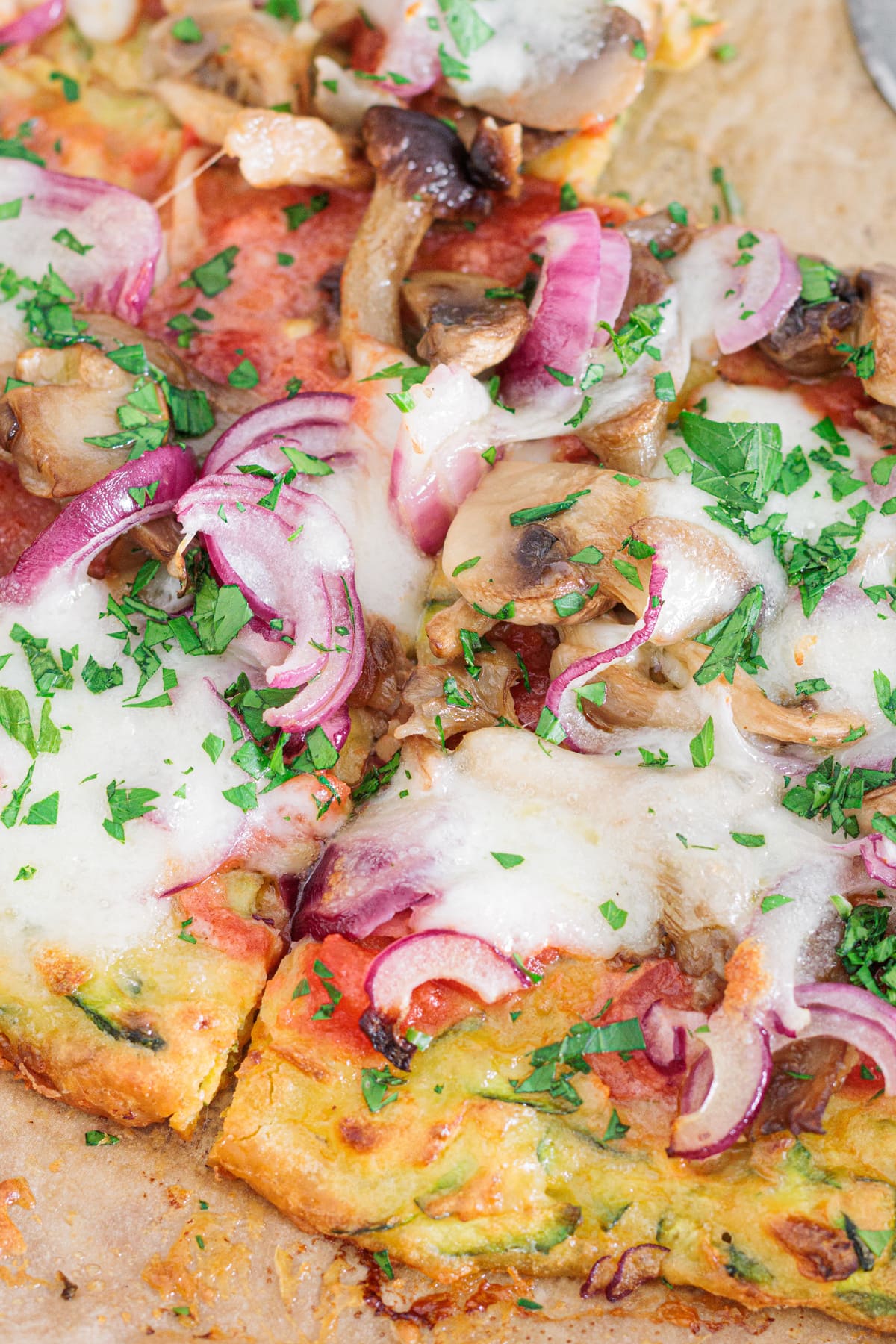 Close-up of zucchini pizza crust