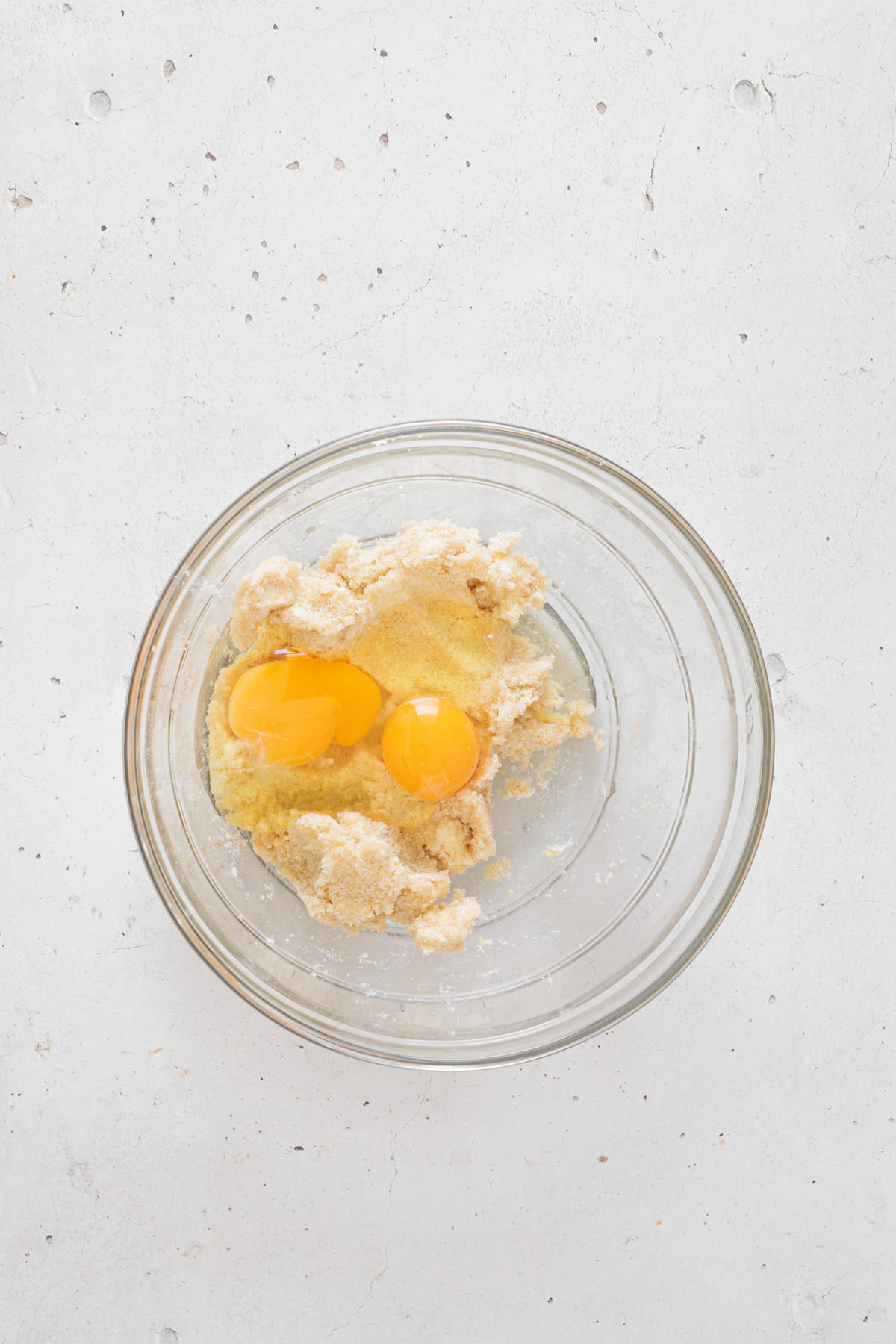 Two eggs added to the creamed butter and sugar mixture.