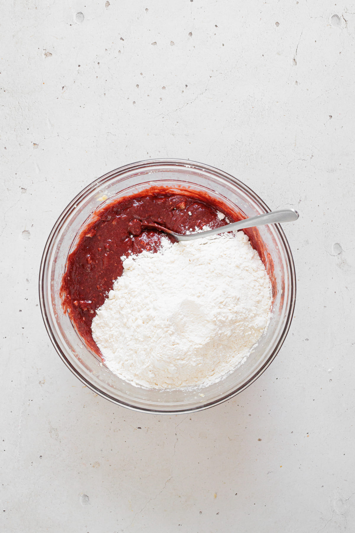 Flour and baking powder added to the red chocolate batter.
