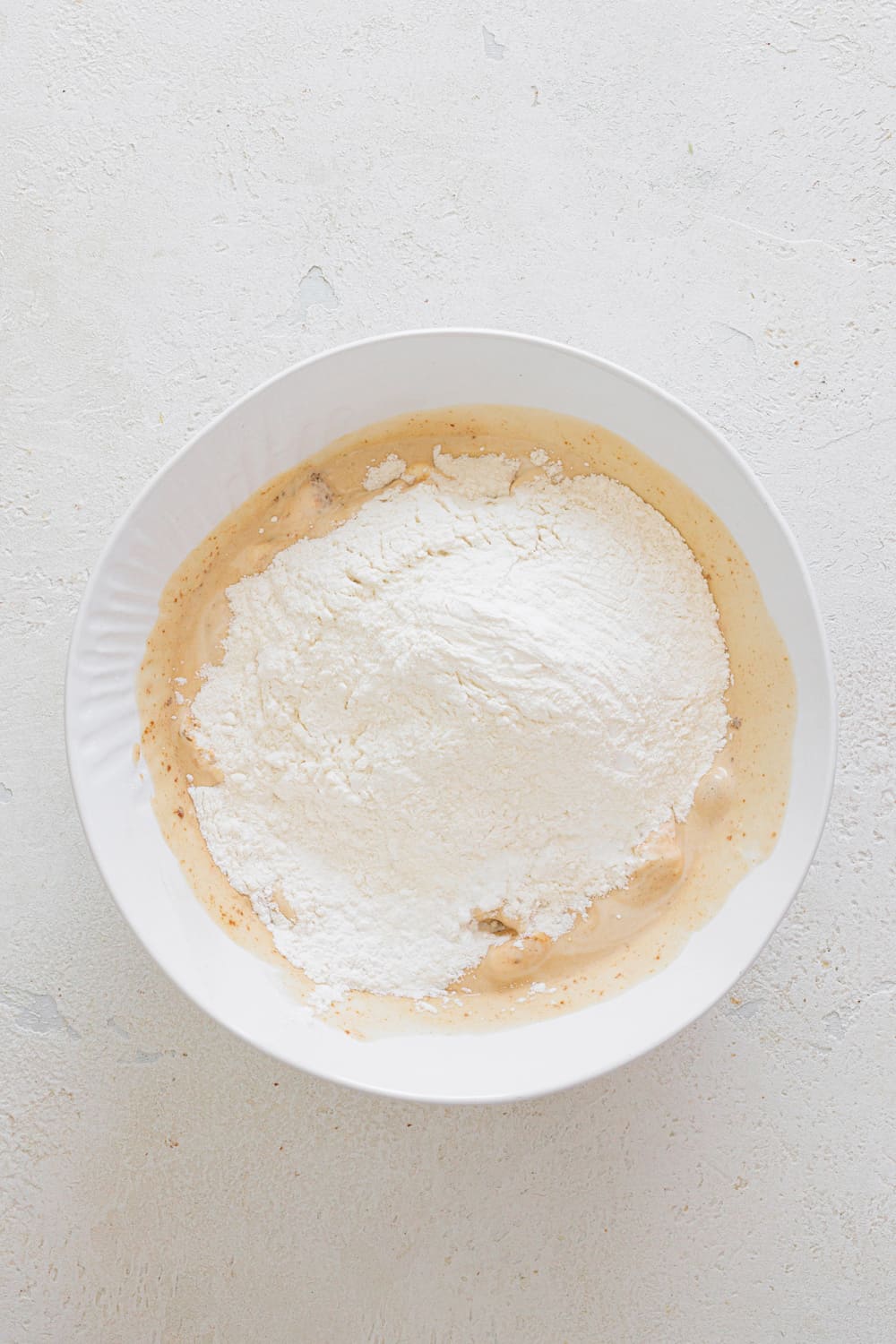 Add the self-rising flour and mix with a spoon or spatula.