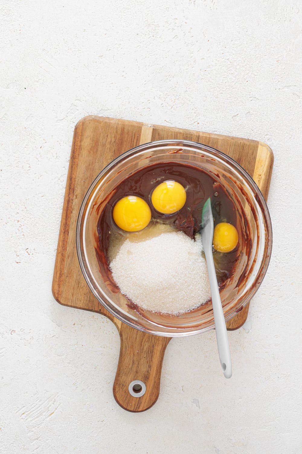 Add the eggs one at a time, mixing after each addition