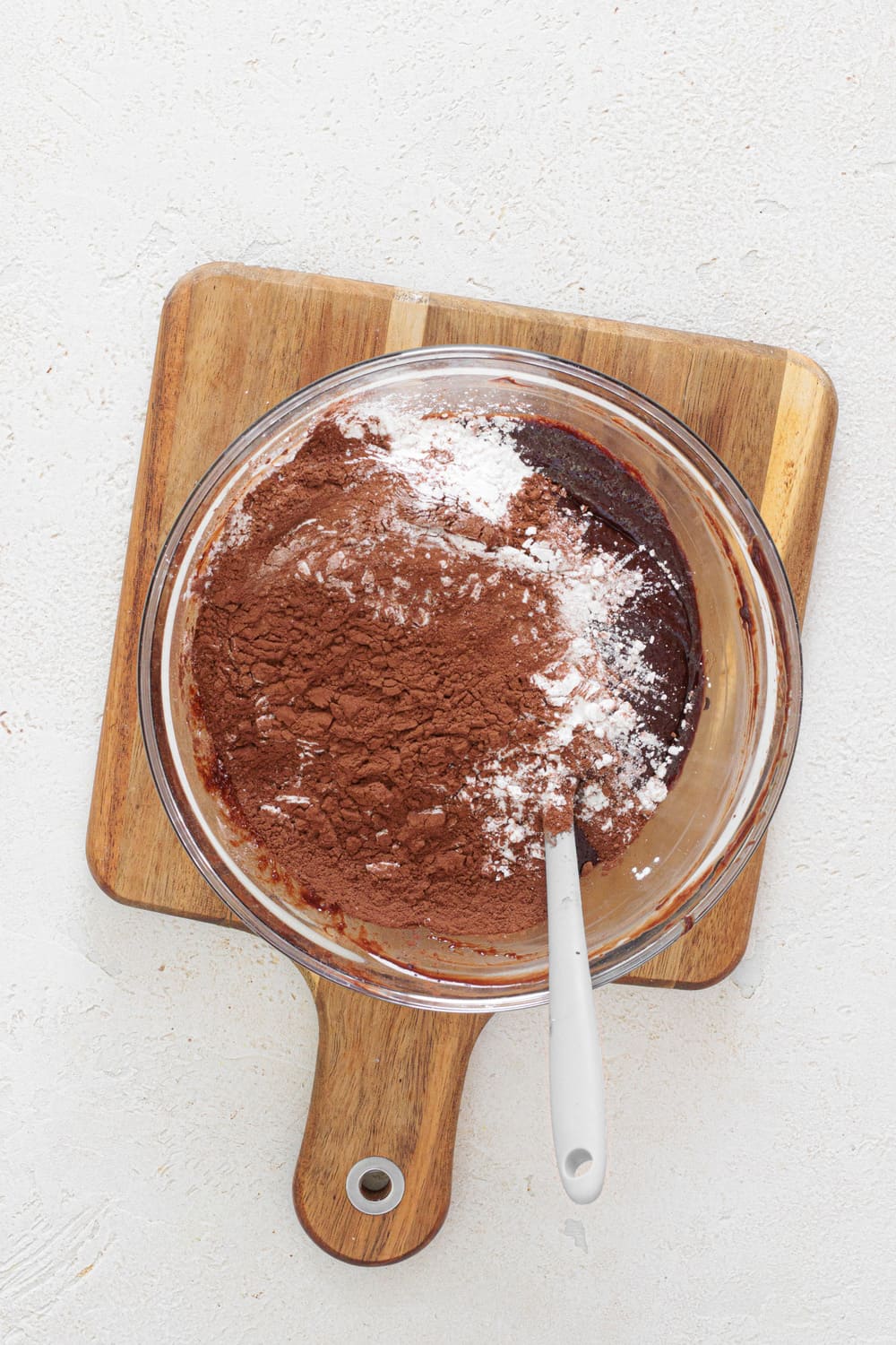 Add the sifted cocoa powder and cornstarch to the chocolate mixture and stir for about 1 minute.