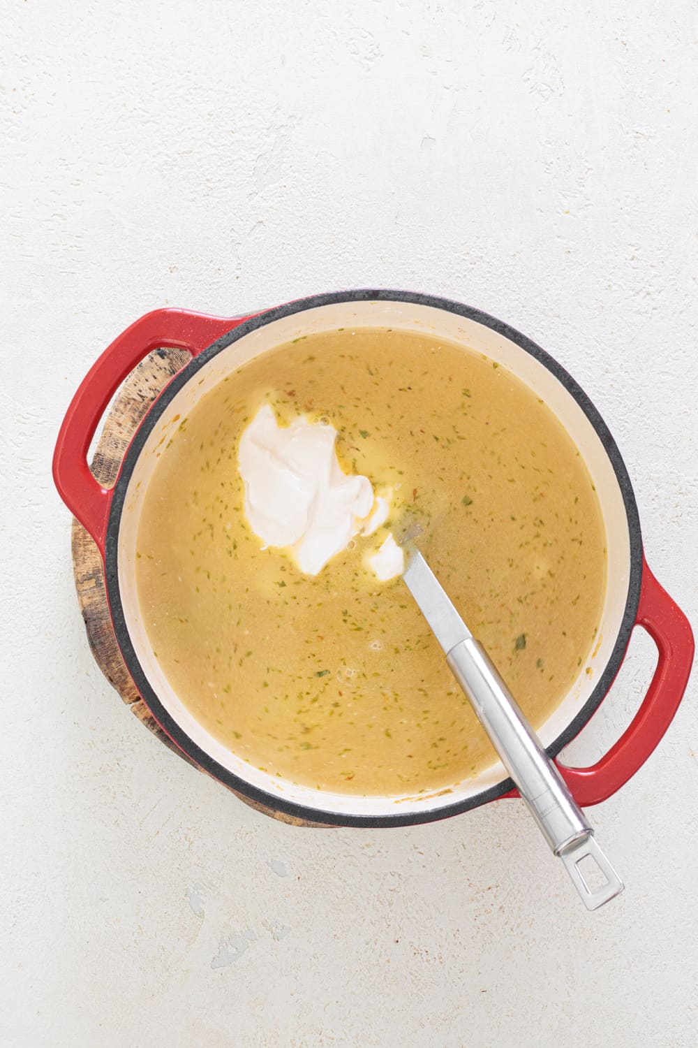 Add the broth and then the cream.