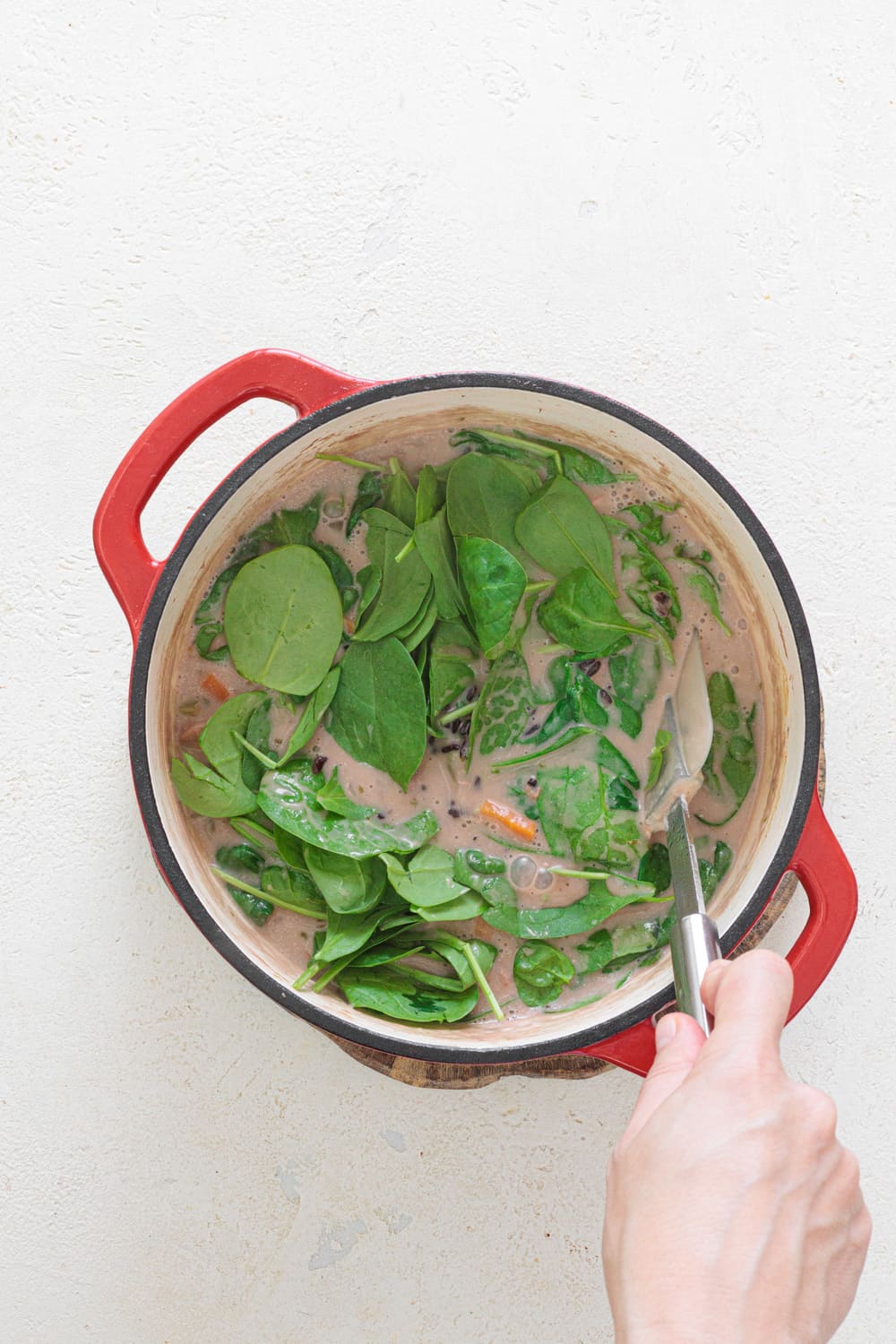 Add the rice and the spinach.