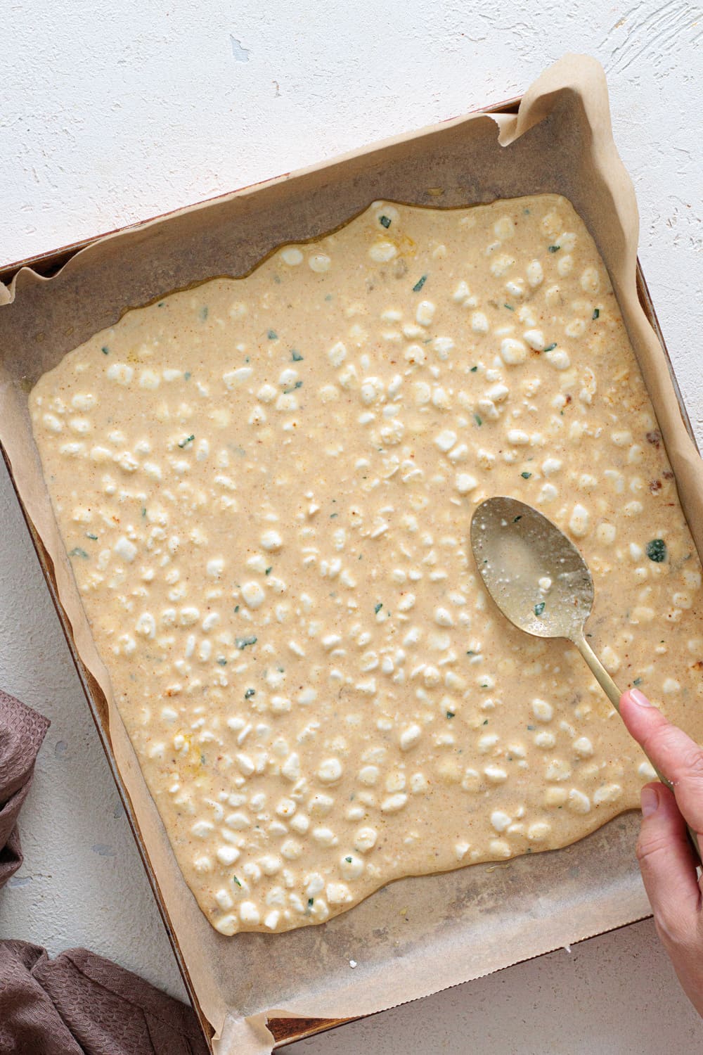 Pour it onto a lined baking tray and spread it out into a thin, even layer.