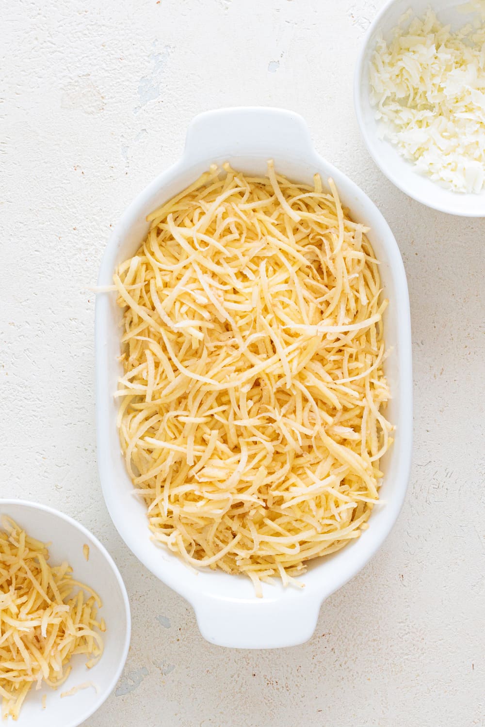 Repeat the process with the remaining hash browns, cheese and salt.