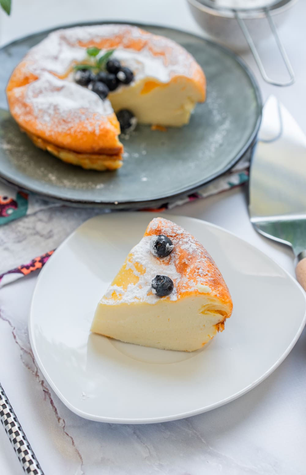 My 3-Ingredient Greek Yogurt Cake with powdered sugar and fresh blueberries.