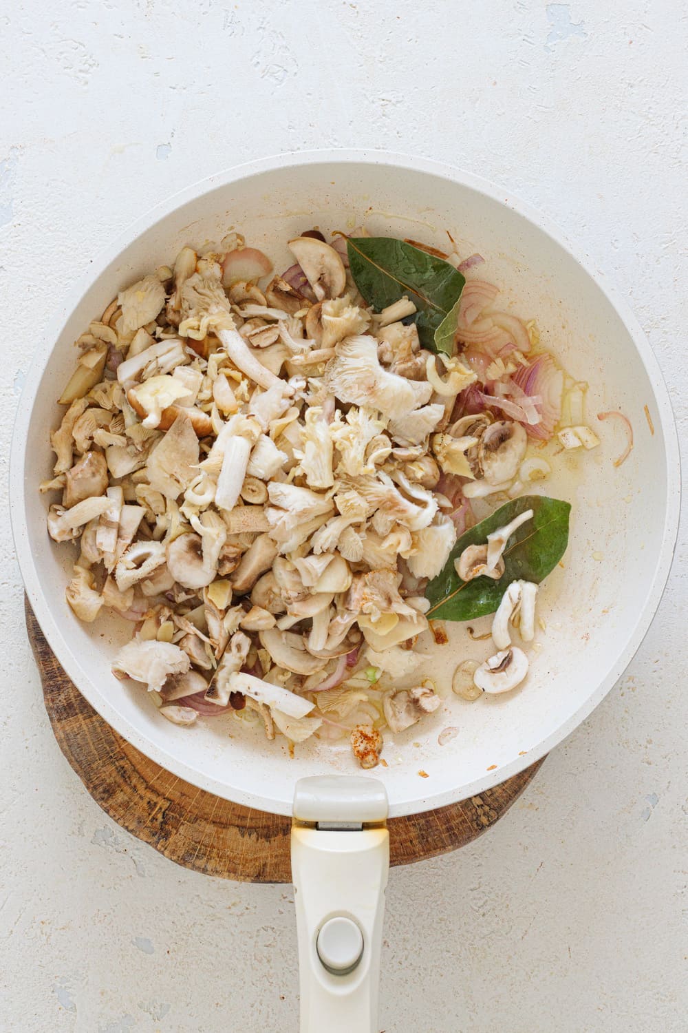 Add the mushrooms to the pan.