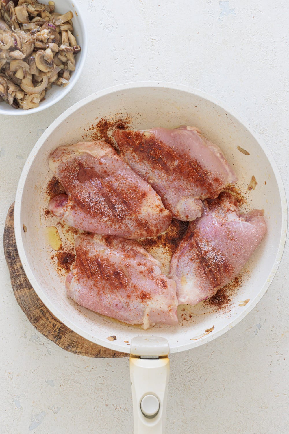Remove everything from the pan and cook the chicken, skin side down.