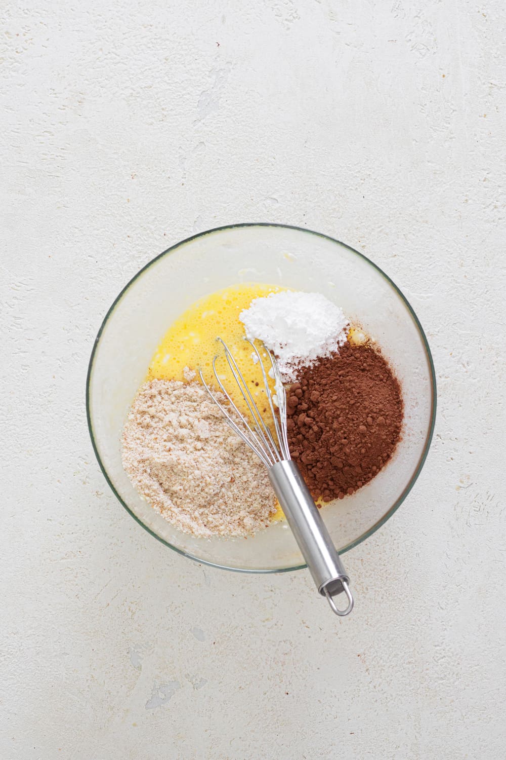 Then add the almond flour, cocoa powder, and powdered sugar.