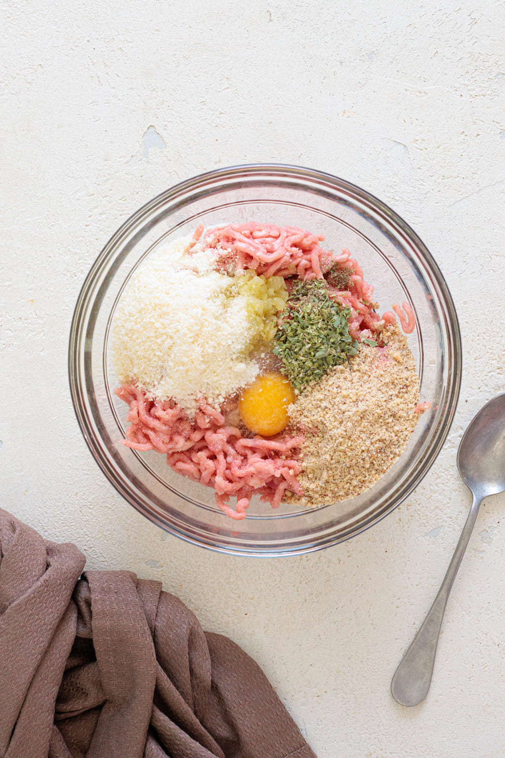 Once slightly cooled, add that to the turkey, egg, Parmesan, almond flour, oregano, and chili flakes.