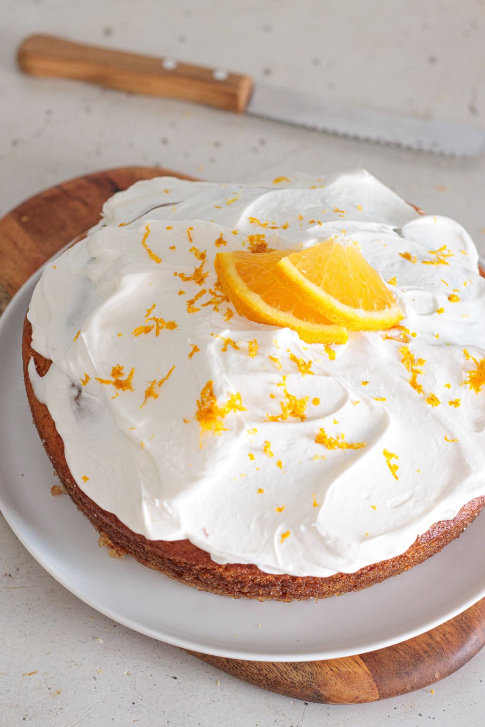 Homemade orange creamsicle cake with citrus cream frosting.